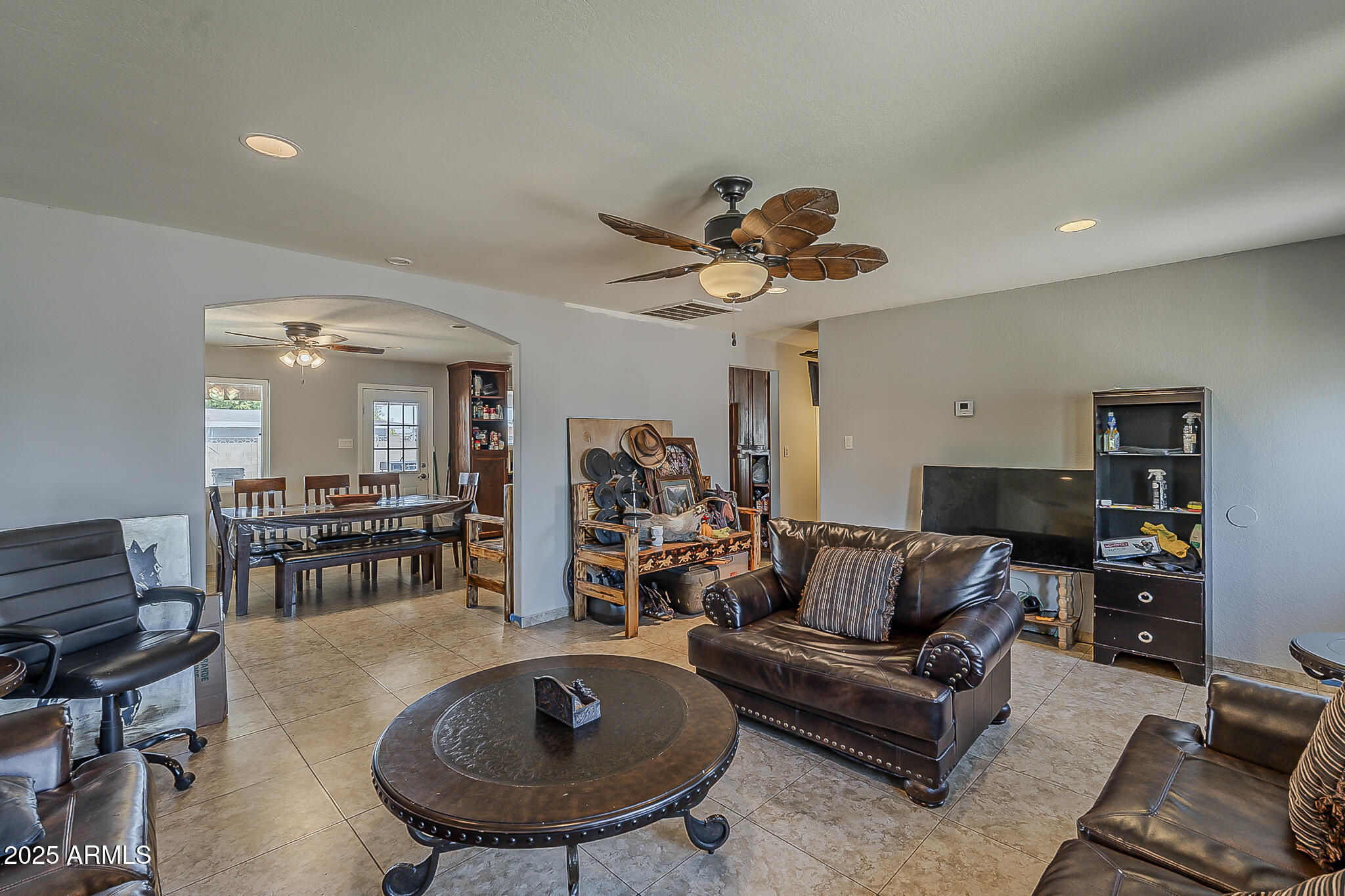 5319 West Osborn Road Phoenix, AZ 85031 - Photo 8 of 37 a living room with furniture and a wooden floor