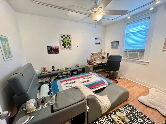 a bedroom with furniture and a window