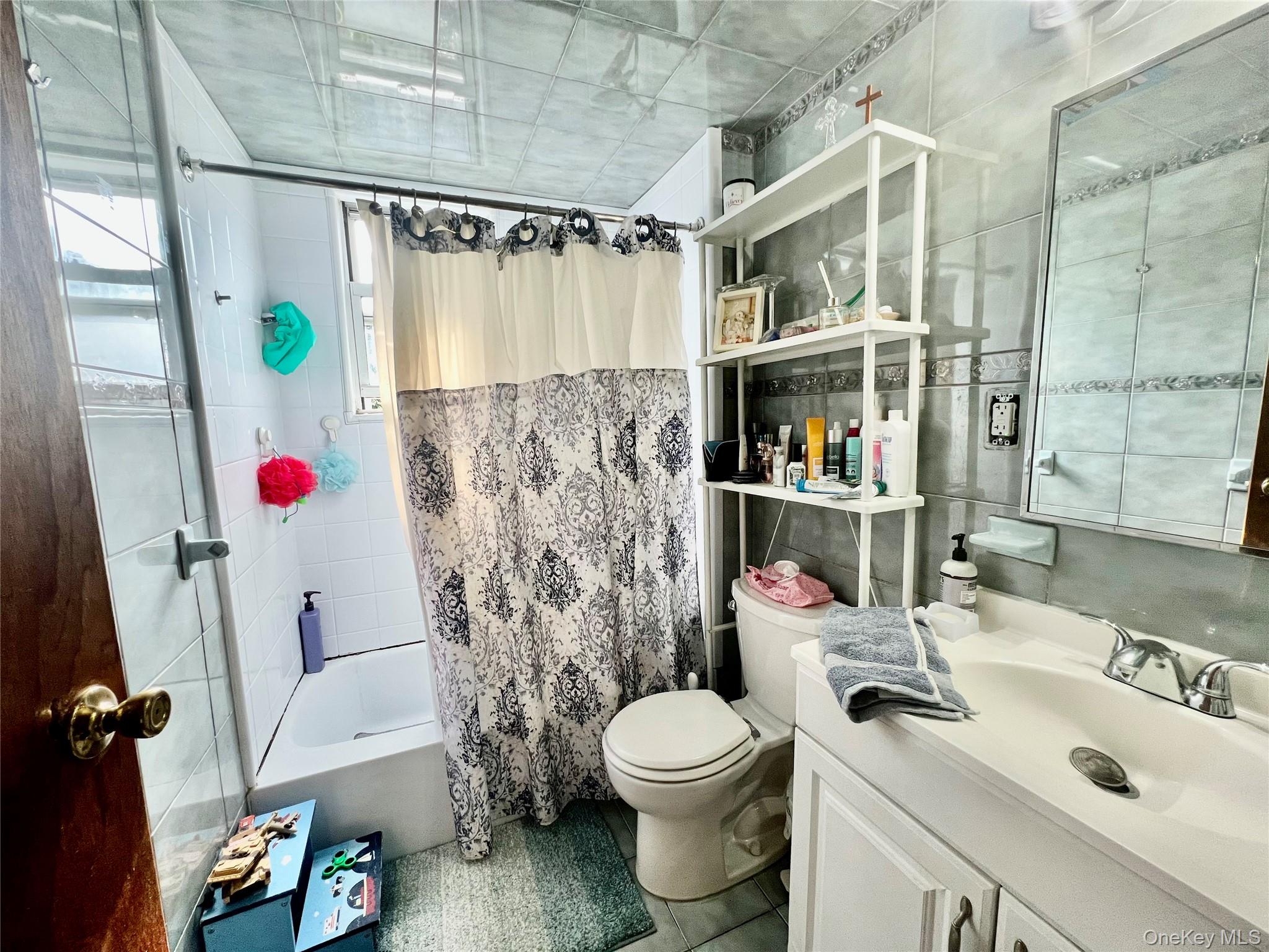 22-26 74th Street Queens, NY 11370 - Photo 13 of 19 a bathroom with a sink toilet and shower