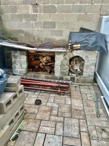 a stove top oven sitting inside of a kitchen