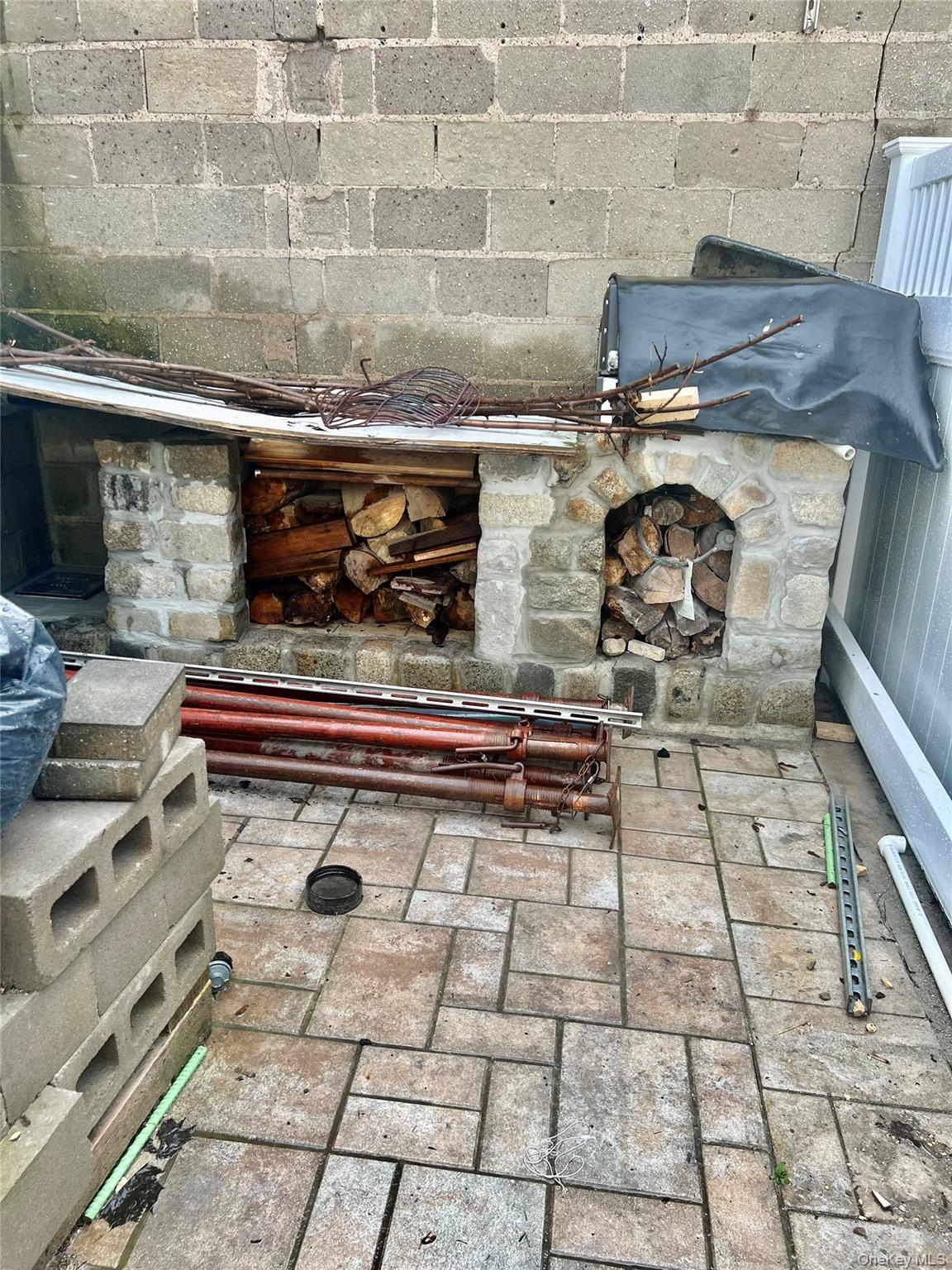 22-26 74th Street Queens, NY 11370 - Photo 17 of 19 a stove top oven sitting inside of a kitchen