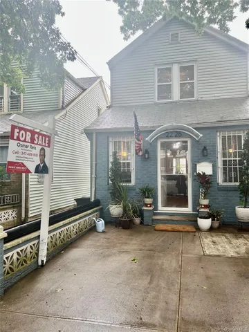 a front view of a house with parking area