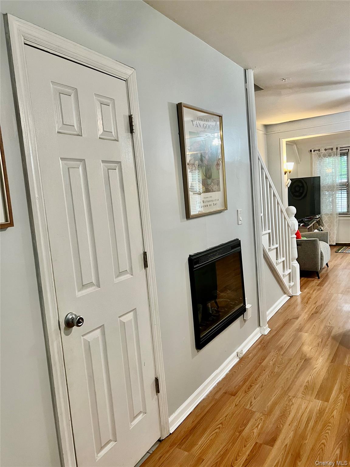 22-26 74th Street Queens, NY 11370 - Photo 5 of 19 a living room with furniture and a fireplace