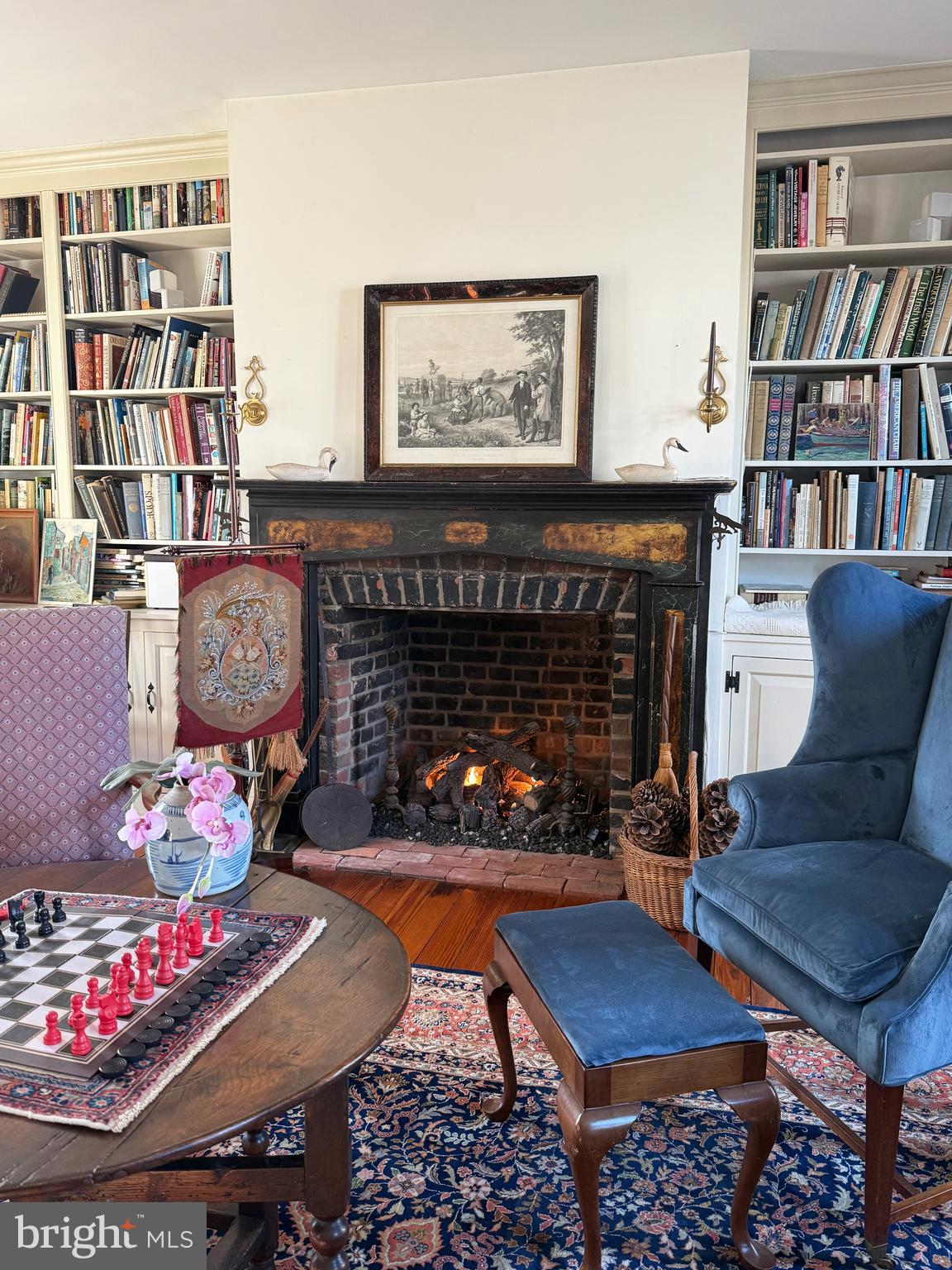 22005 Main Street Hillsboro, MD 21641 - Photo 14 of 74 a living room with furniture a rug and a book shelf