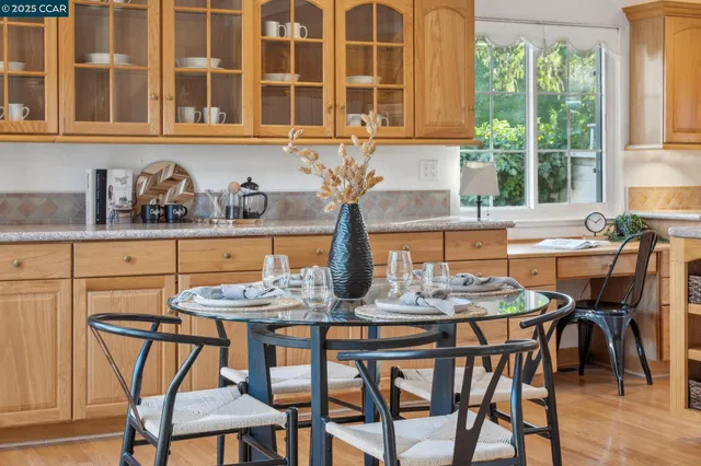 a living room with furniture and flowers