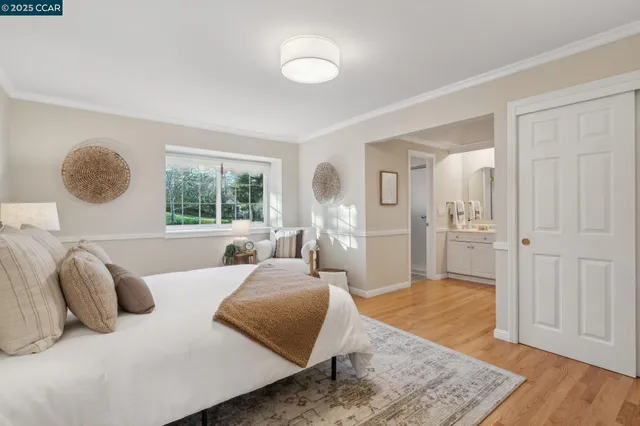 a spacious bathroom with a granite countertop sink a toilet and a mirror
