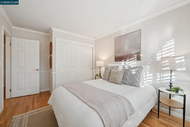 a roof deck with table and chairs and wooden floor