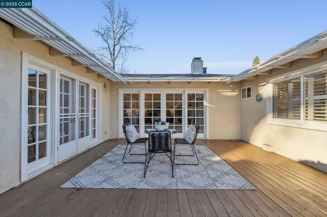 a balcony view with a seating space