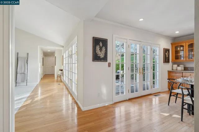 a living room with furniture a fireplace and a potted plant