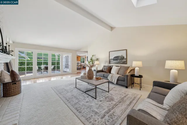 a view of a dining room with furniture and chandelier