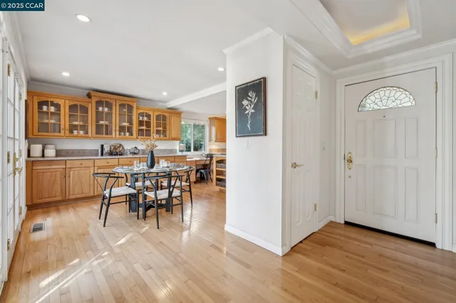 a kitchen with center island table and chairs