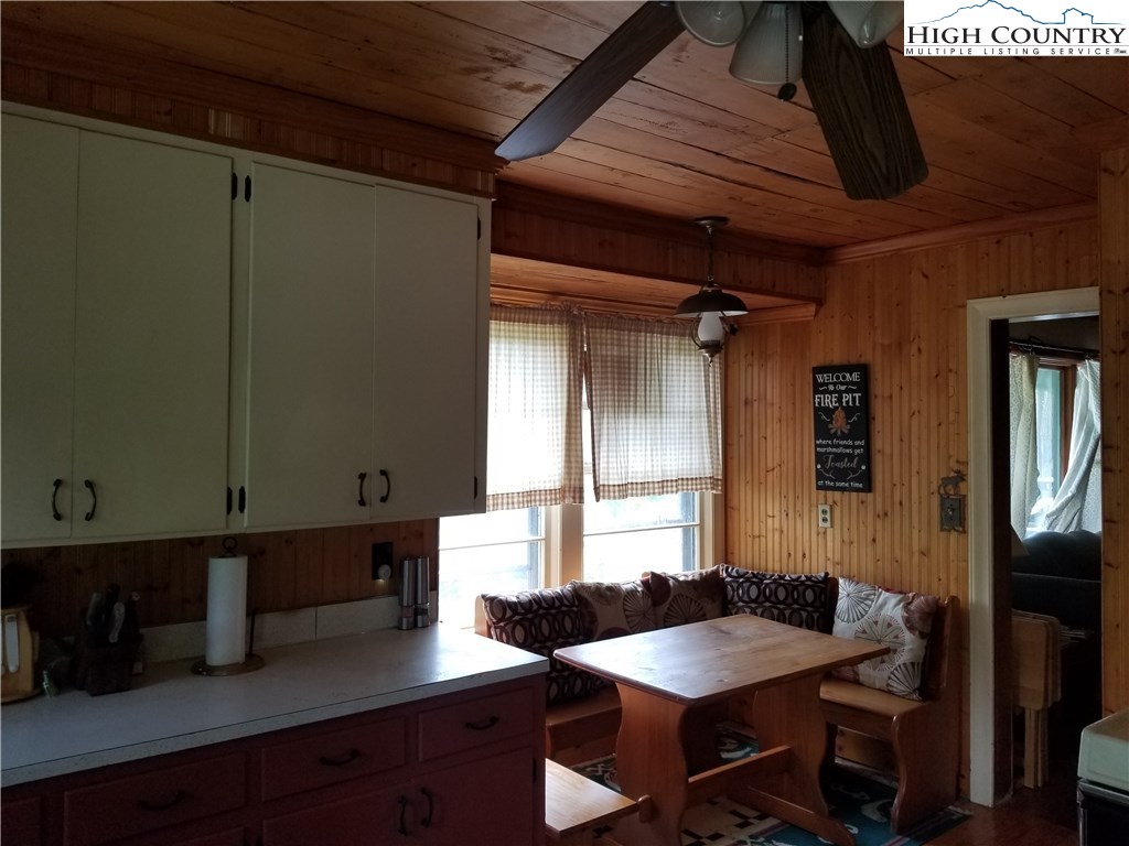 1310 Dark Ridge Road Elk Park, NC 28622 - Photo 10 of 14 a kitchen with a table chairs and a window