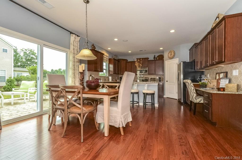 79184 Ridgehaven Road, Unit 295 Lancaster, SC 29720 - Photo 6 of 19 a view of a dining room with furniture window and wooden floor