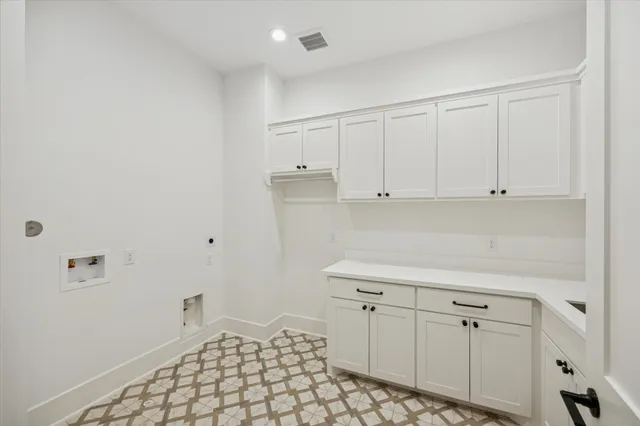 a view of a bathroom with a sink and a mirror