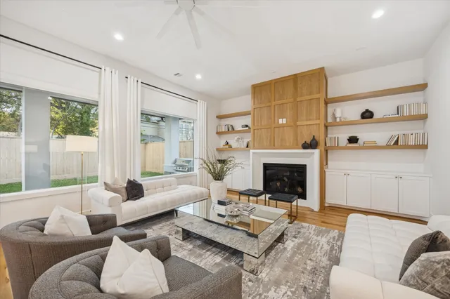 a living room with furniture and a fireplace