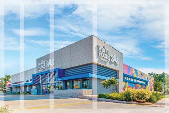 a front view of a building with retail shops