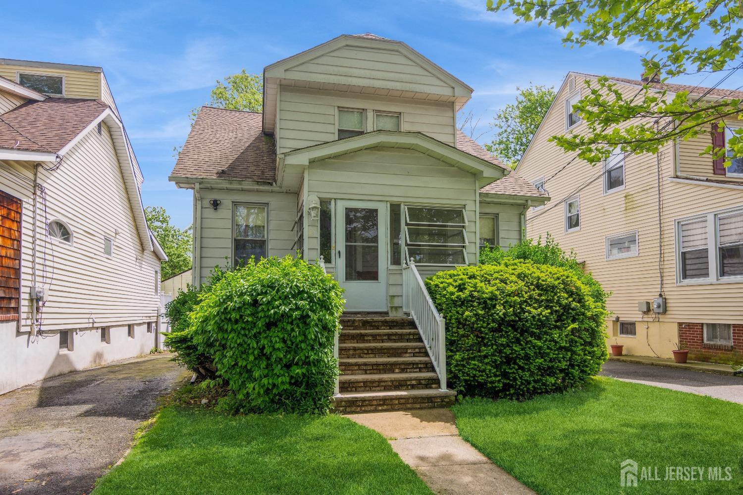 83 South Maple Avenue Springfield, NJ 07081 - Photo 1 of 38 a front view of a house with a yard