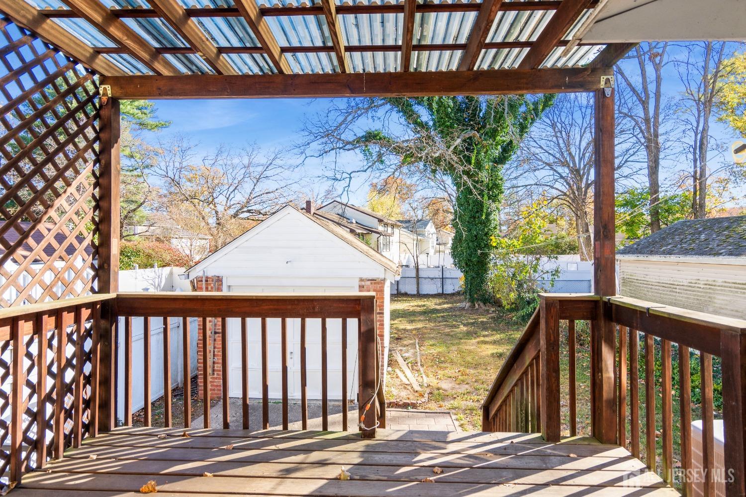 83 South Maple Avenue Springfield, NJ 07081 - Photo 27 of 38 a view of balcony with wooden floor and fence