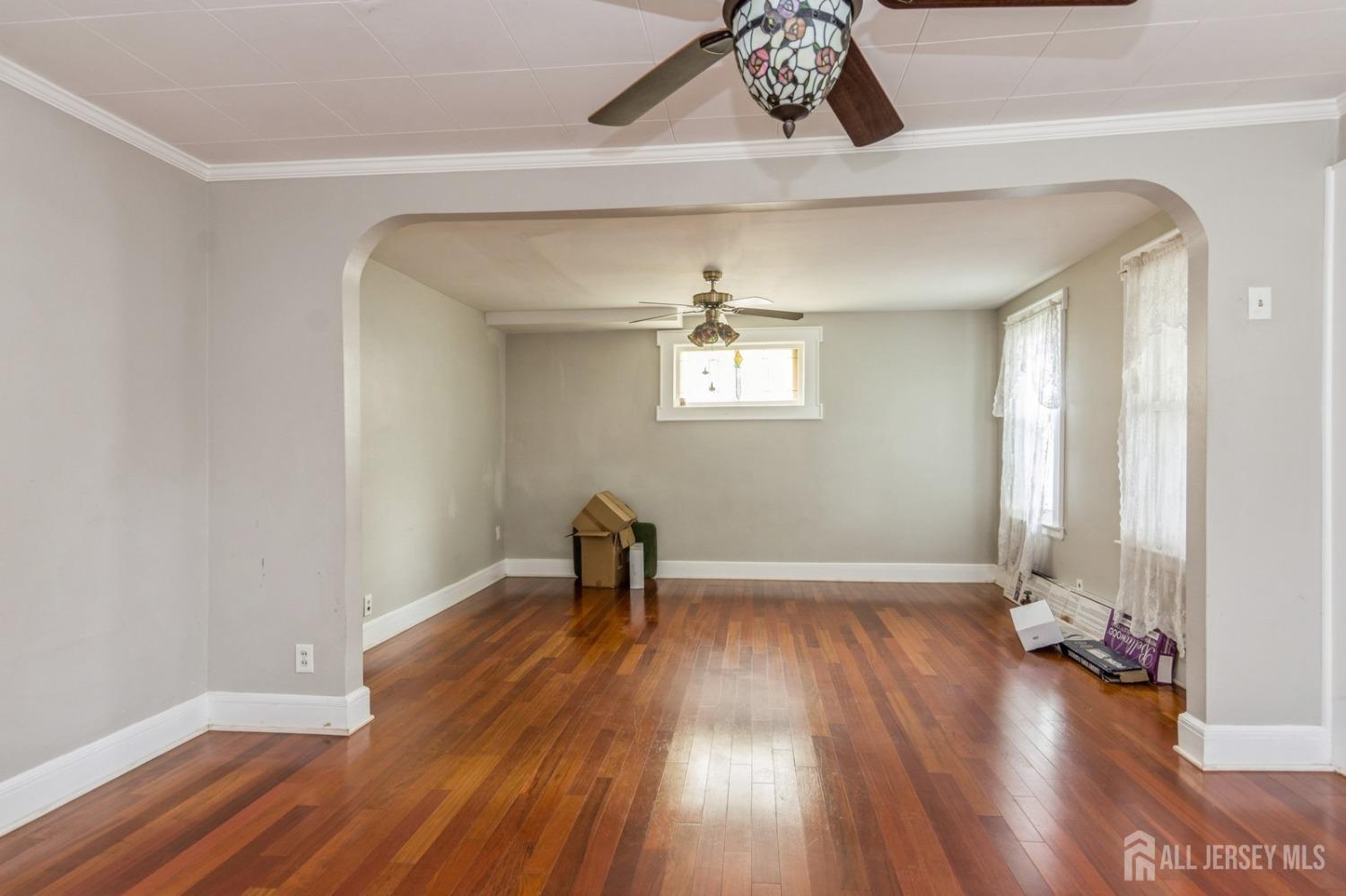83 South Maple Avenue Springfield, NJ 07081 - Photo 9 of 38 a view of empty room with wooden floor