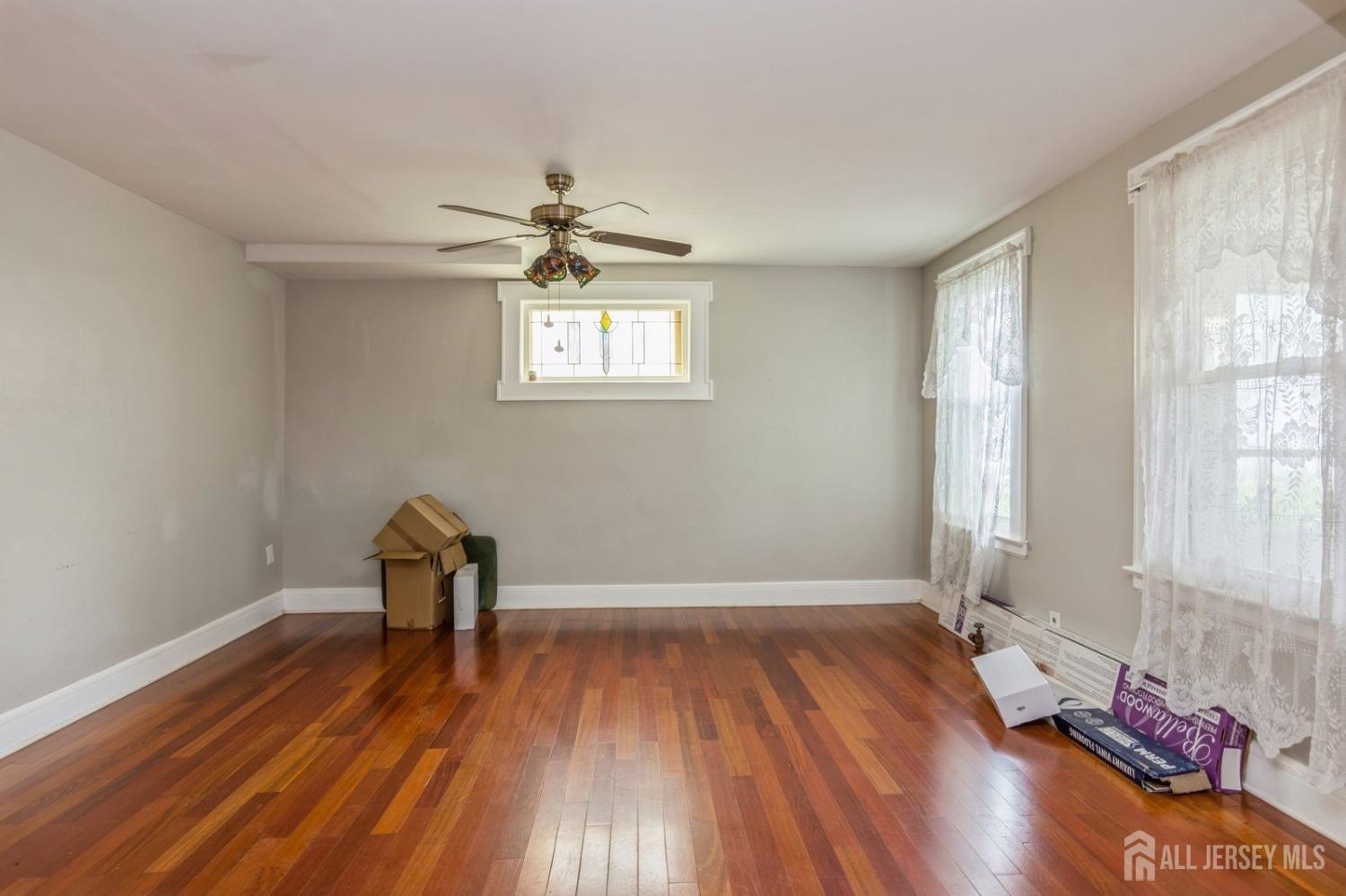 83 South Maple Avenue Springfield, NJ 07081 - Photo 10 of 38 wooden floor in an empty room with a window