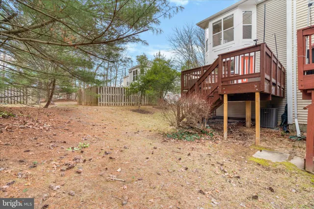 a view of a yard with brick walls