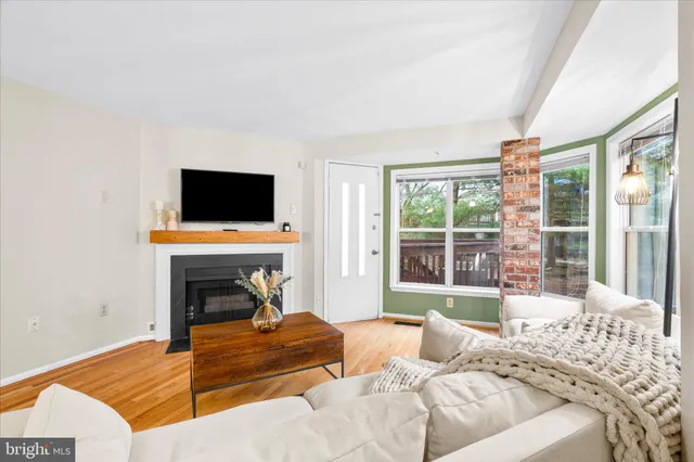 a bedroom with furniture and a flat screen tv