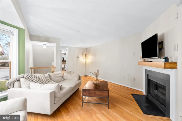 a spacious bedroom with a bed and a flat screen tv