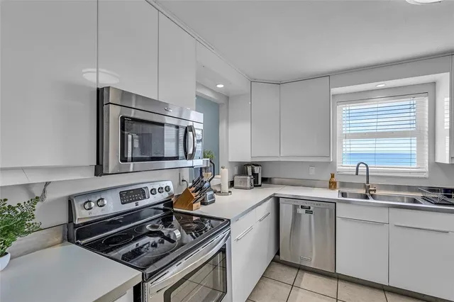 a bathroom with a granite countertop shower and a toilet
