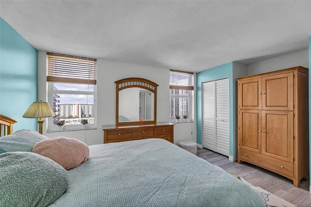 a bedroom with bed and a night stand