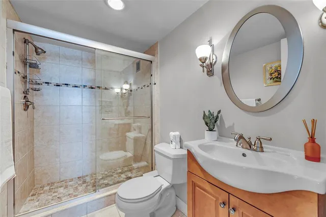 a bedroom with a large bed and a lamp