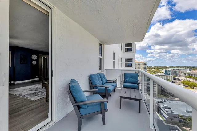 a view of a swimming pool with a lawn chairs