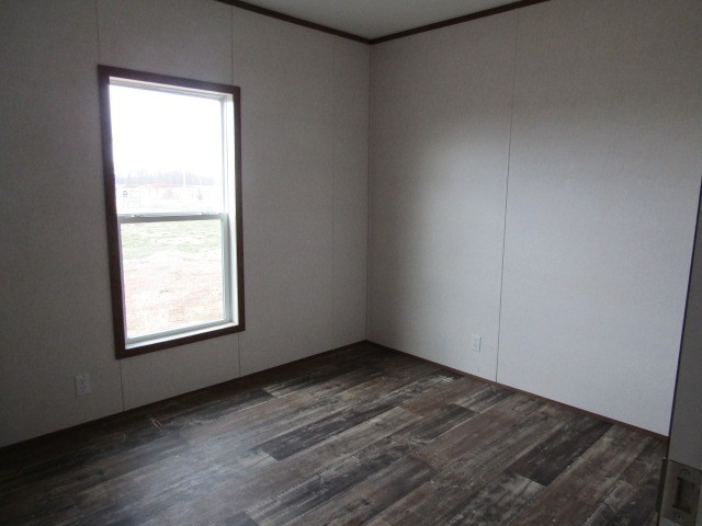 9578 Sunrise Road Red Boiling Springs, TN 37150 - Photo 13 of 19 an empty room with wooden floor and windows