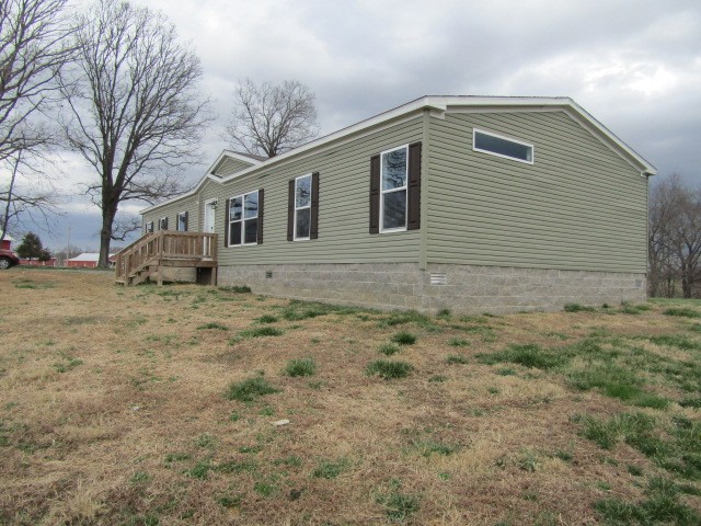 9578 Sunrise Road Red Boiling Springs, TN 37150 - Photo 18 of 19 a front view of house with yard
