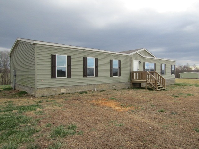 9578 Sunrise Road Red Boiling Springs, TN 37150 - Photo 2 of 19 a house with lots of trees