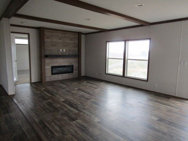 9578 Sunrise Road Red Boiling Springs, TN 37150 - Photo 5 of 19 an empty room with wooden floor fire place and windows