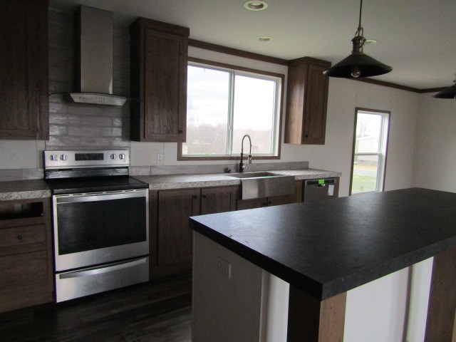9578 Sunrise Road Red Boiling Springs, TN 37150 - Photo 7 of 19 a kitchen with stainless steel appliances granite countertop a sink a stove and microwave