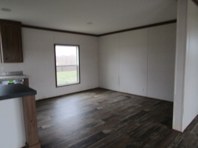 9578 Sunrise Road Red Boiling Springs, TN 37150 - Photo 8 of 19 an empty room with wooden floor and windows