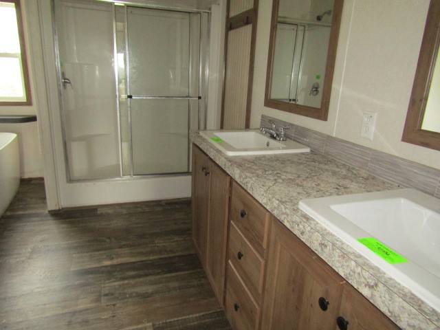 9578 Sunrise Road Red Boiling Springs, TN 37150 - Photo 10 of 19 a bathroom with a granite countertop sink and a mirror