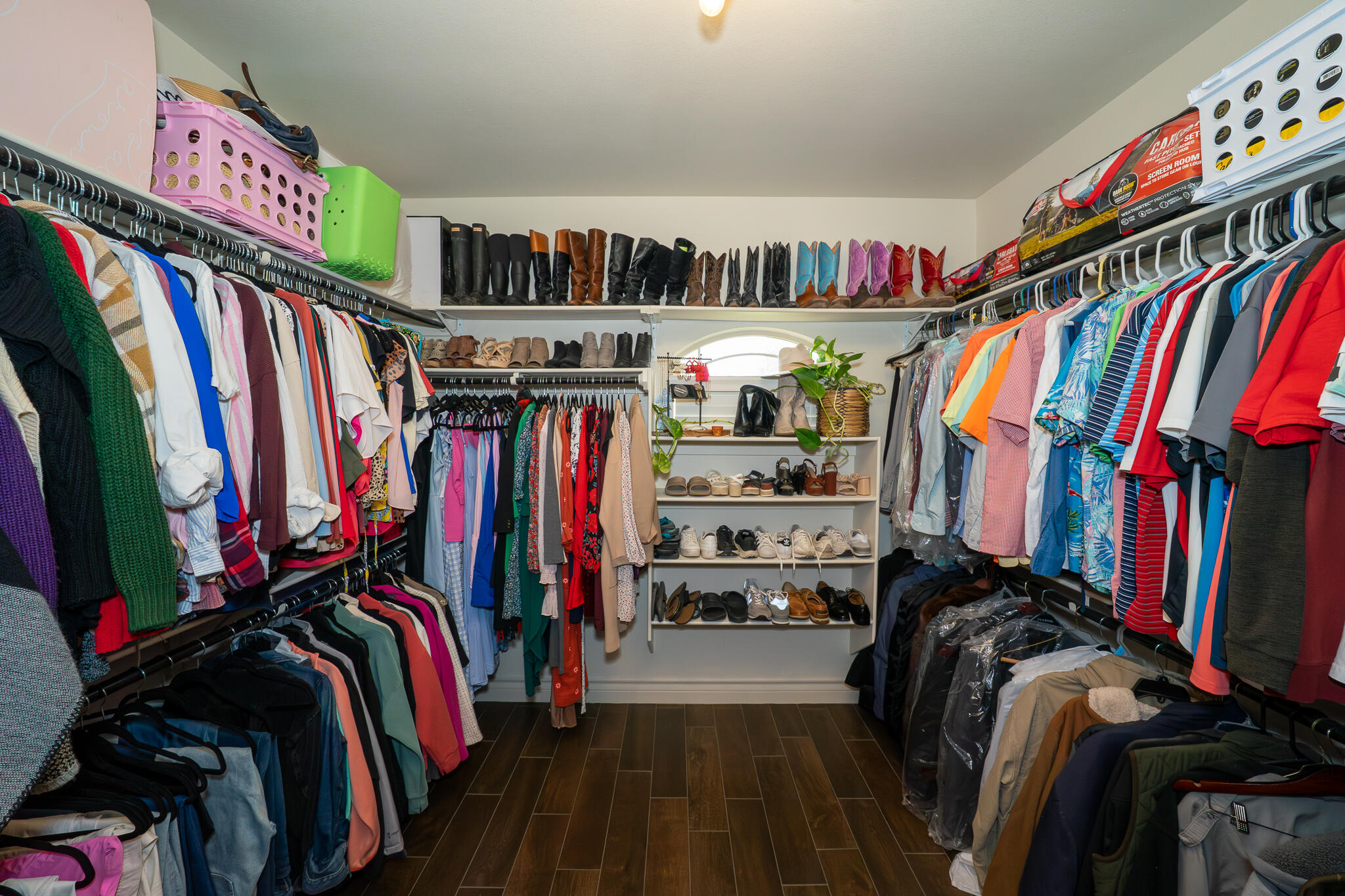 3301 County Road 7560 Lubbock, TX 79423 - Photo 24 of 40 a view of walk in closet with clothes and shoes
