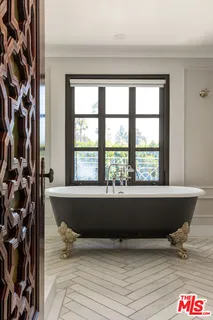 a living room with a table and a window