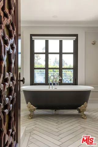 a living room with a table and a window