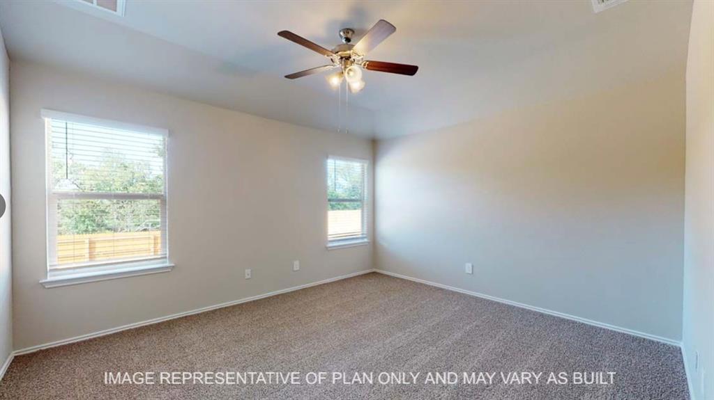 10212 Neptune Court Waco, TX 76708 - Photo 9 of 22 Carpeted spare room featuring baseboards and a ceiling fan