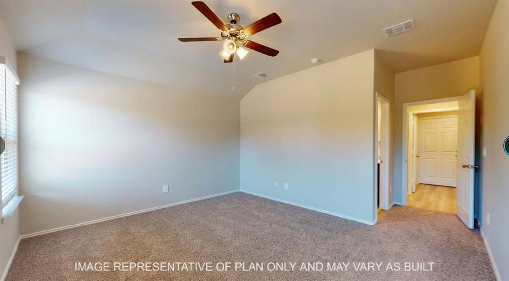 10212 Neptune Court Waco, TX 76708 - Photo 10 of 22 Carpeted spare room with a ceiling fan and vaulted ceiling