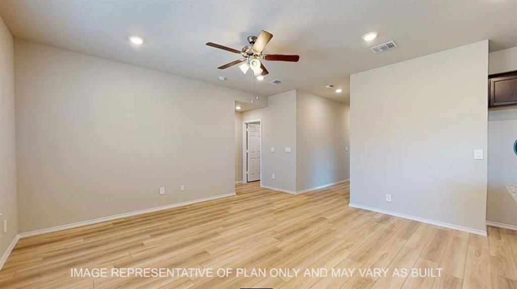 10212 Neptune Court Waco, TX 76708 - Photo 3 of 22 Unfurnished room featuring light wood finished floors, a ceiling fan, and recessed lighting