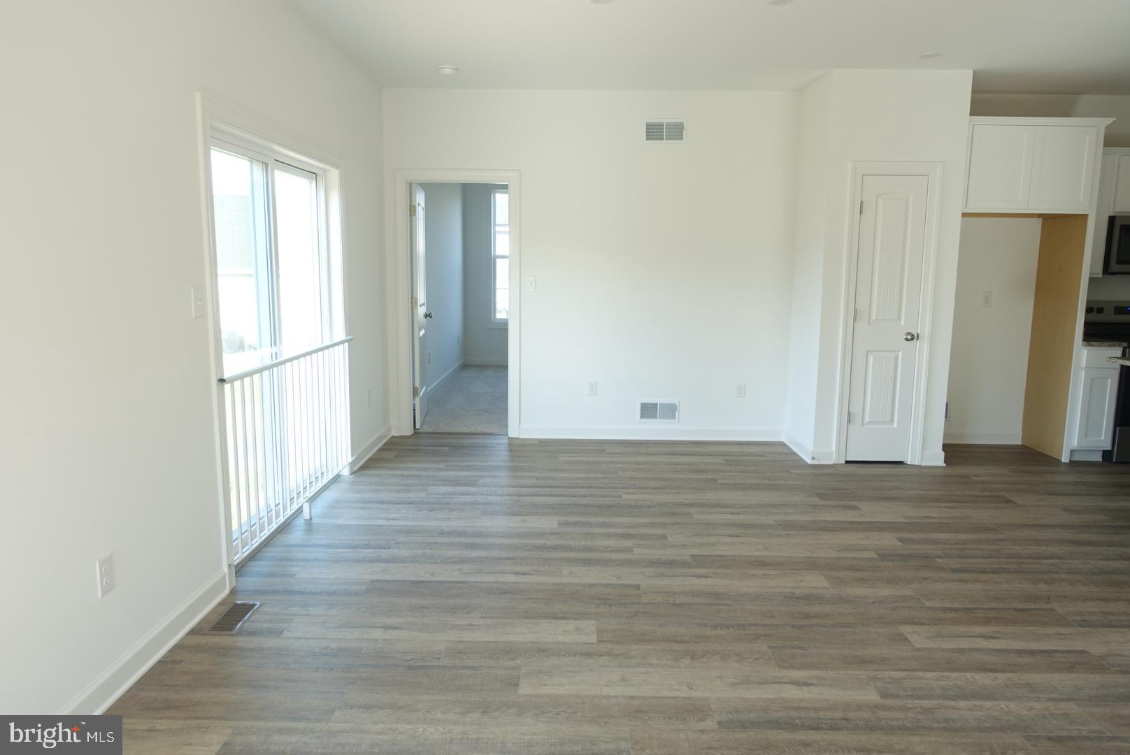 201 Kinneman Road, Unit 25 Abbottstown, PA 17301 - Photo 15 of 32 a view of a hallway with wooden floor