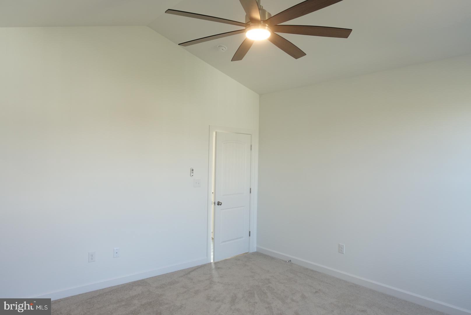 201 Kinneman Road, Unit 25 Abbottstown, PA 17301 - Photo 20 of 32 an empty room with a fan and a fan