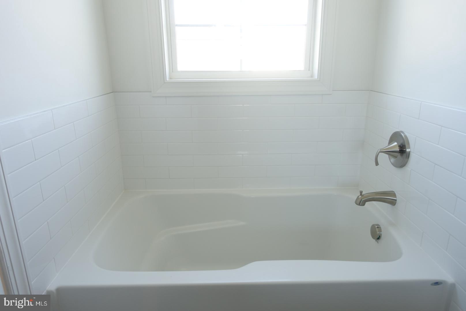 201 Kinneman Road, Unit 25 Abbottstown, PA 17301 - Photo 24 of 32 a close up of a bathtub in a bathroom