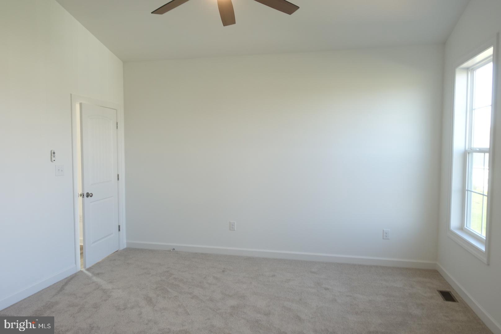 201 Kinneman Road, Unit 25 Abbottstown, PA 17301 - Photo 25 of 32 an empty room with a window