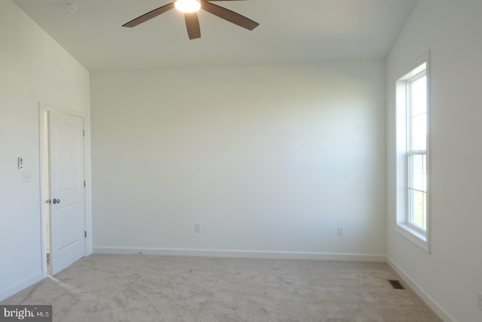 201 Kinneman Road, Unit 25 Abbottstown, PA 17301 - Photo 26 of 32 an empty room with a window
