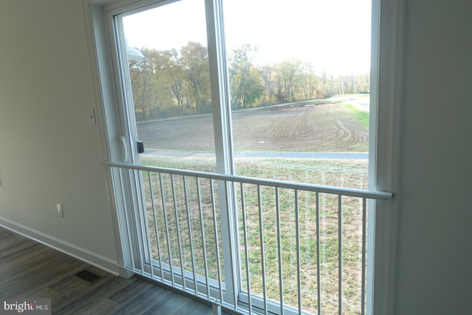 201 Kinneman Road, Unit 25 Abbottstown, PA 17301 - Photo 27 of 32 a view of a glass door with a balcony